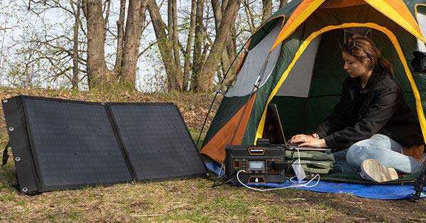 woman in tent using Blackfire products outdoors