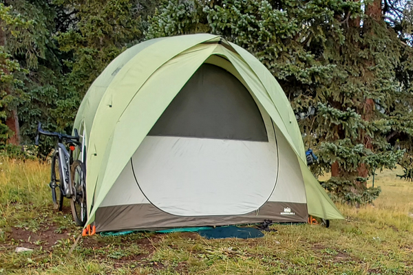 tent with forest in background